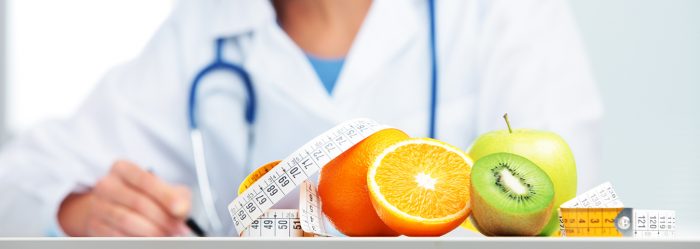 Nutritionist female Doctor in her office. Focus on fruit